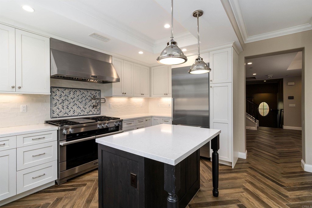 728 Silver Street La Jolla, CA 92037 - Photo 6 of 44 a kitchen with a stove a refrigerator and a stove