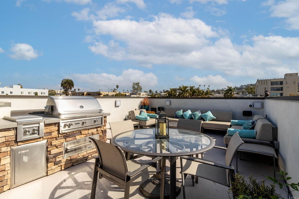 728 Silver Street La Jolla, CA 92037 - Photo 8 of 44 a roof deck with table and chairs