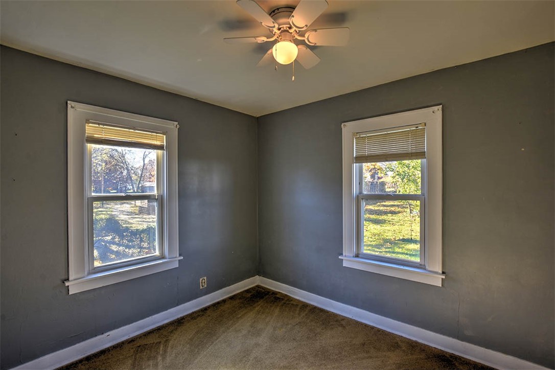 1765 South Fairview Avenue Decatur, IL 62521 - Photo 14 of 24 a view of an empty room with window and chandelier fan