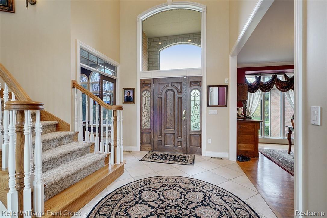 525 Sheldon Court Rochester, MI 48306 - Photo 14 of 66 Entry Door with leaded glass Side Lights and large window - tons of natural light let in.