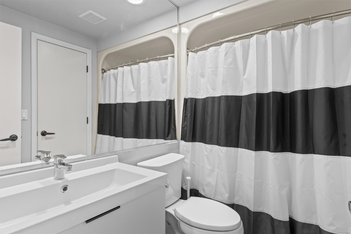 1724 Ski Time Square Drive, Unit R6 Steamboat Springs, CO 80487 - Photo 19 of 39 a bathroom with a sink a toilet and a tub