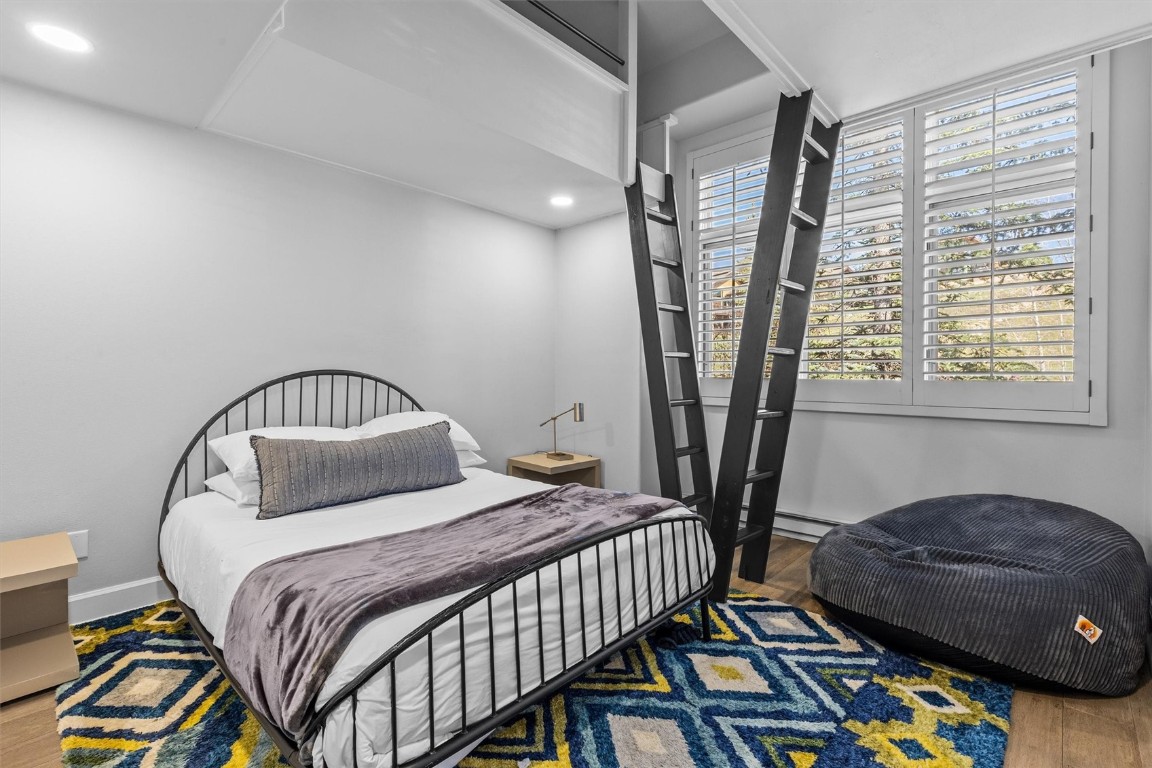 1724 Ski Time Square Drive, Unit R6 Steamboat Springs, CO 80487 - Photo 20 of 39 a bedroom with a bed closet and a window