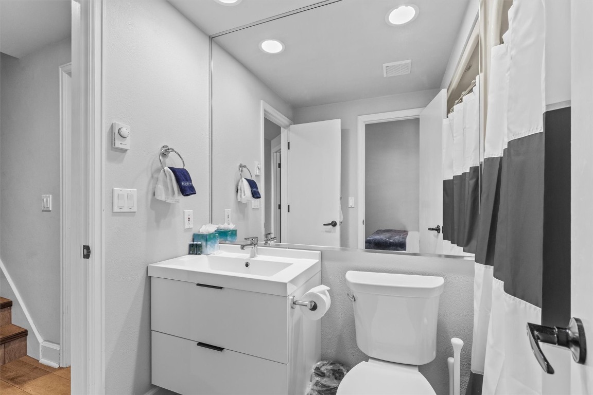 1724 Ski Time Square Drive, Unit R6 Steamboat Springs, CO 80487 - Photo 22 of 39 a bathroom with a toilet sink and mirror