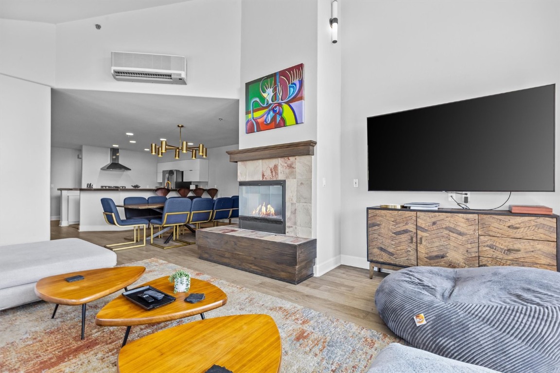 1724 Ski Time Square Drive, Unit R6 Steamboat Springs, CO 80487 - Photo 5 of 39 a living room with furniture flat screen tv and a fireplace