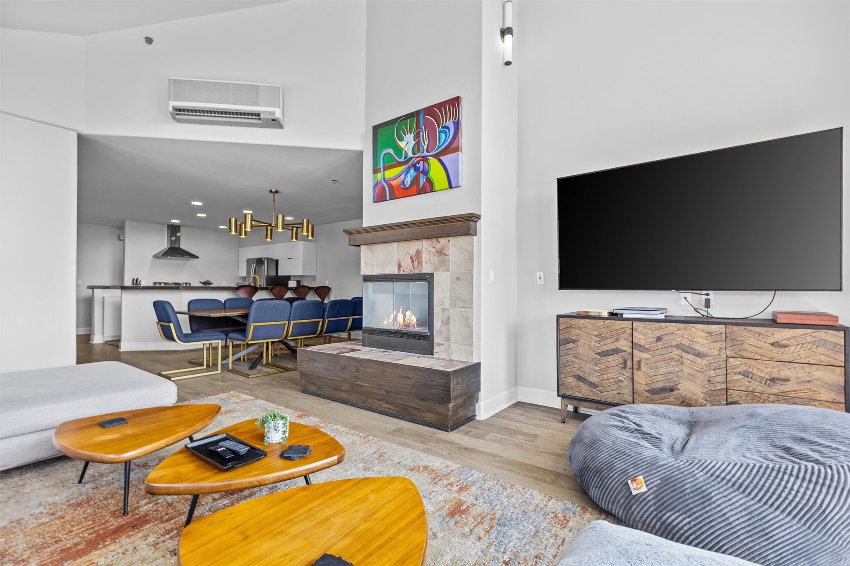 1724 Ski Time Square Drive, Unit R6 Steamboat Springs, CO 80487 - Photo 5 of 39 a living room with furniture flat screen tv and a fireplace