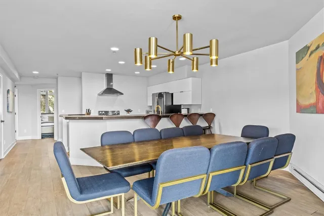 a view of kitchen with dining table and chairs