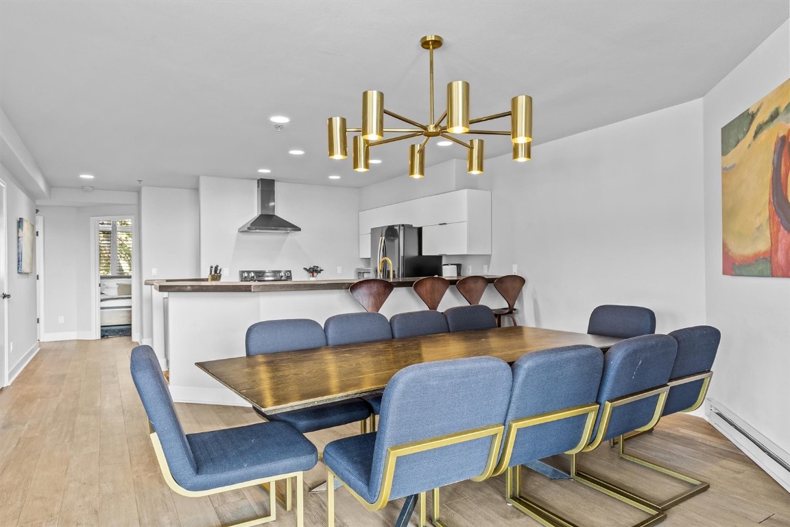 1724 Ski Time Square Drive, Unit R6 Steamboat Springs, CO 80487 - Photo 7 of 39 a view of kitchen with dining table and chairs