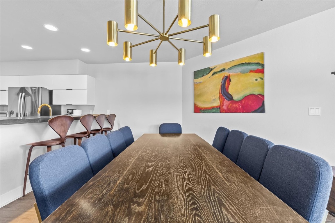 1724 Ski Time Square Drive, Unit R6 Steamboat Springs, CO 80487 - Photo 8 of 39 a bedroom with furniture and wooden floor