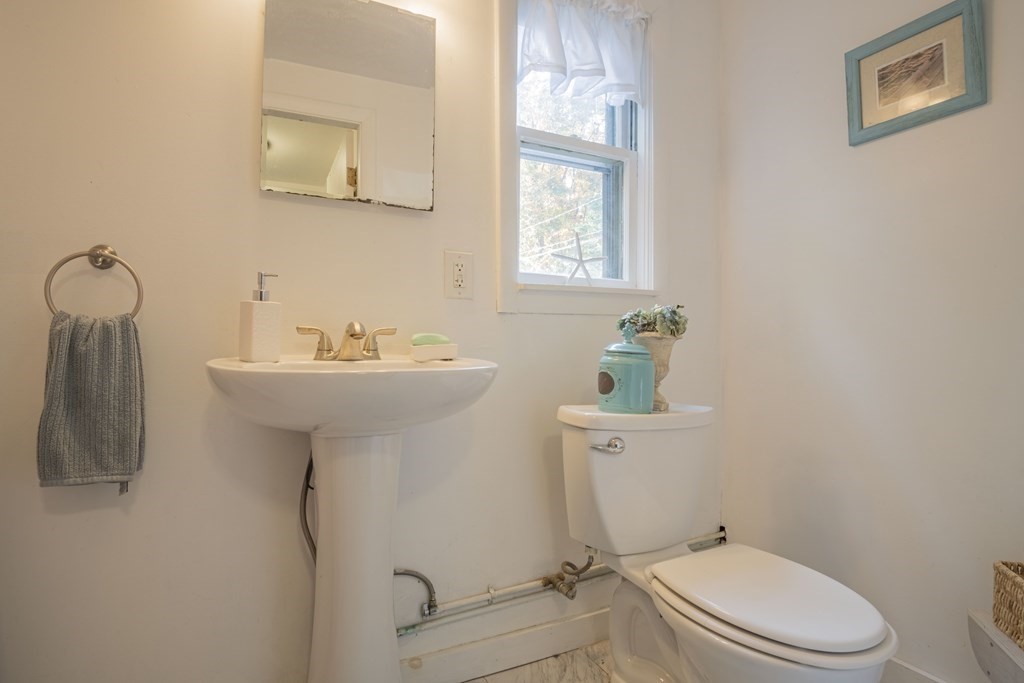 9 Nonantum Road Marblehead, MA 01945 - Photo 11 of 21 a bathroom with a sink a toilet and mirror