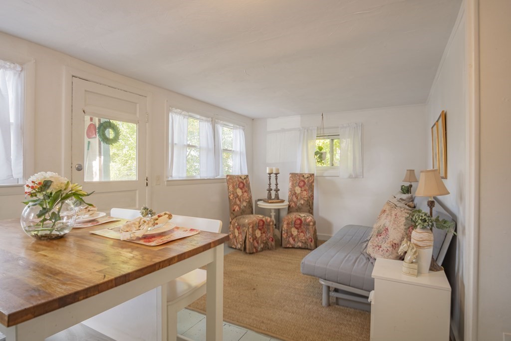 9 Nonantum Road Marblehead, MA 01945 - Photo 6 of 21 a living room with furniture and a potted plant