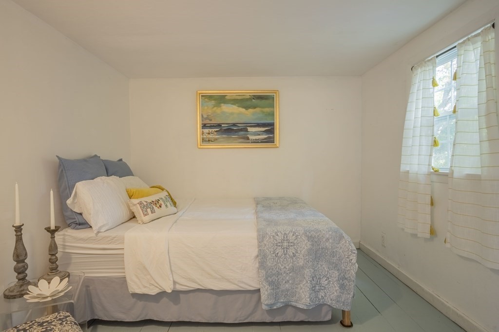 9 Nonantum Road Marblehead, MA 01945 - Photo 8 of 21 a bedroom with a bed and a window