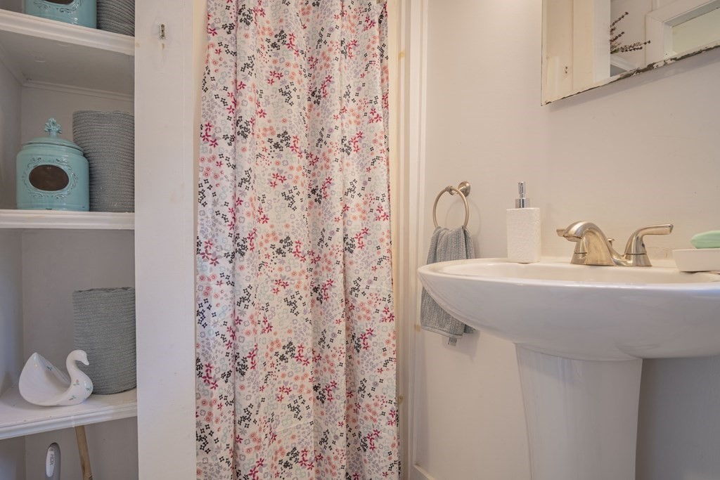 9 Nonantum Road Marblehead, MA 01945 - Photo 10 of 21 a bathroom with a sink toilet and shower