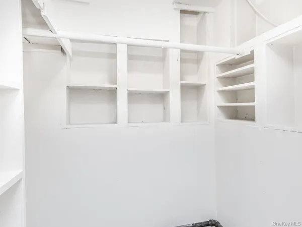 a view of an empty walk in closet