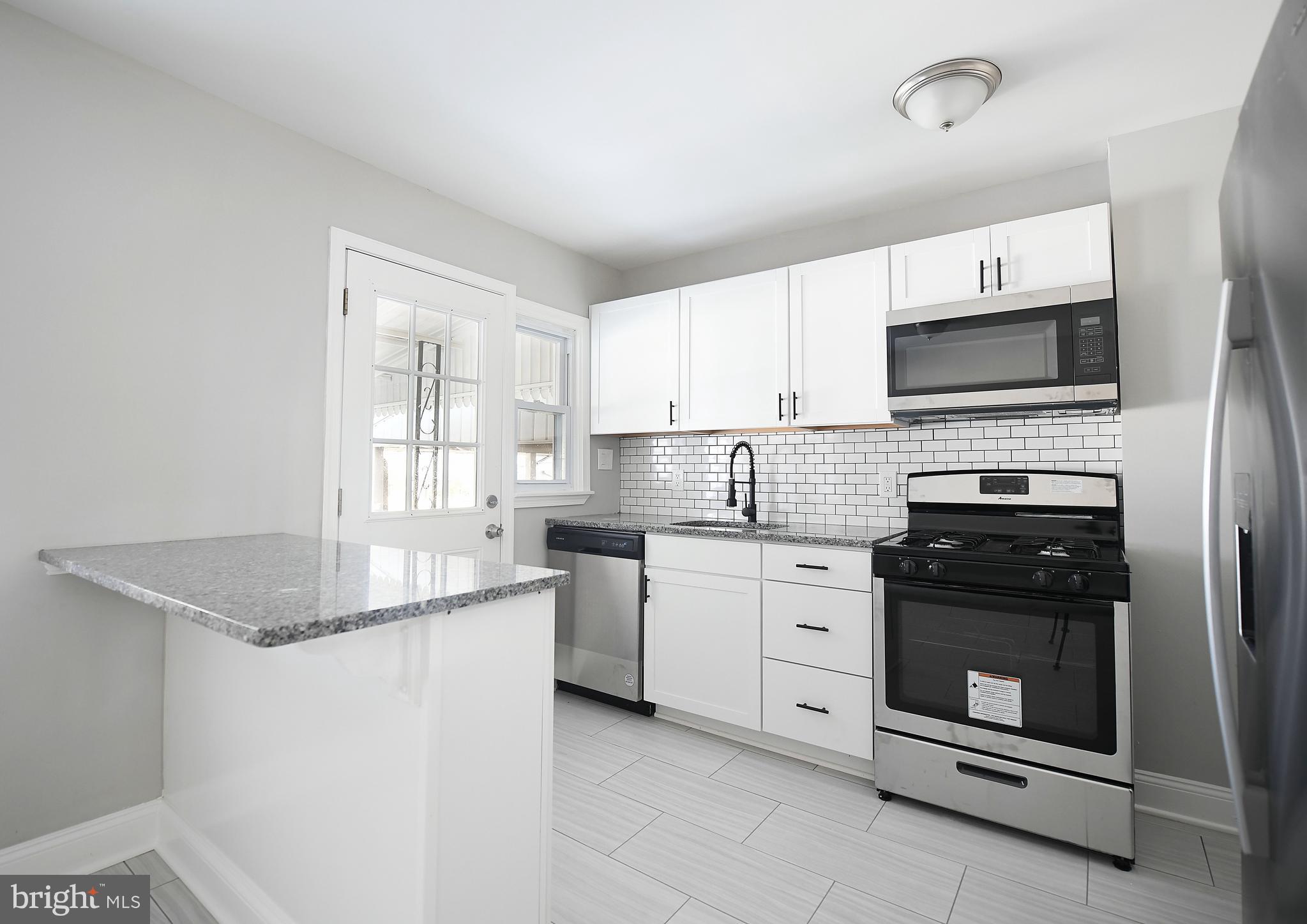8106 Kavanagh Road Baltimore, MD 21222 - Photo 2 of 24 Modern and bright kitchen with granite countertops
