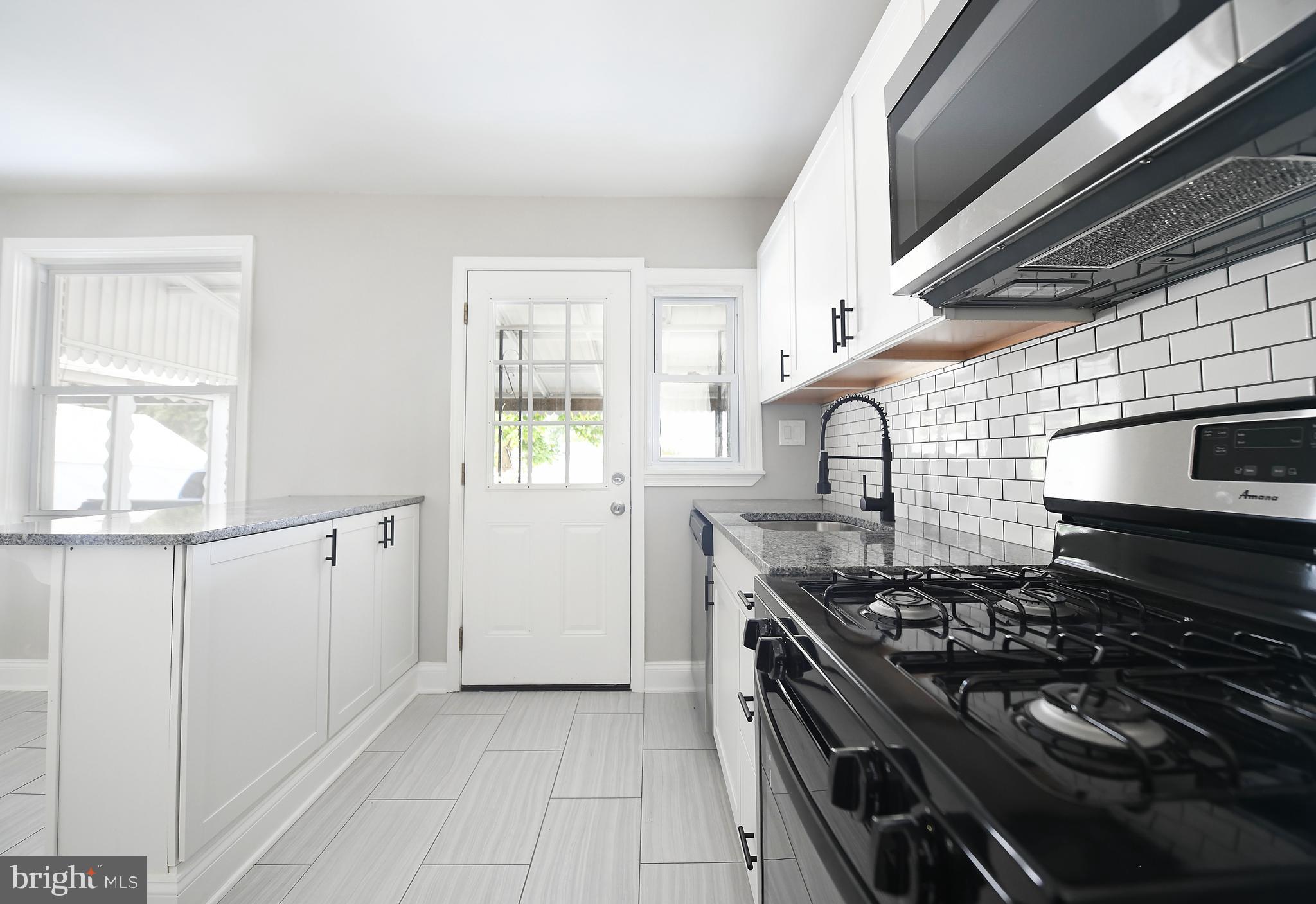 8106 Kavanagh Road Baltimore, MD 21222 - Photo 9 of 24 Kitchen counter seating and storage