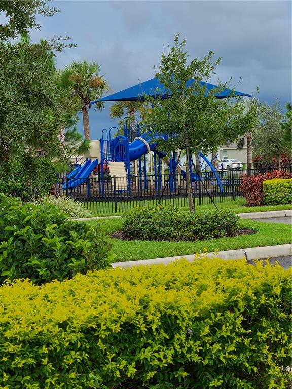 10209 Kalamazoo Place Parrish, FL 34219 - Photo 17 of 25 a view of a garden with an apartment