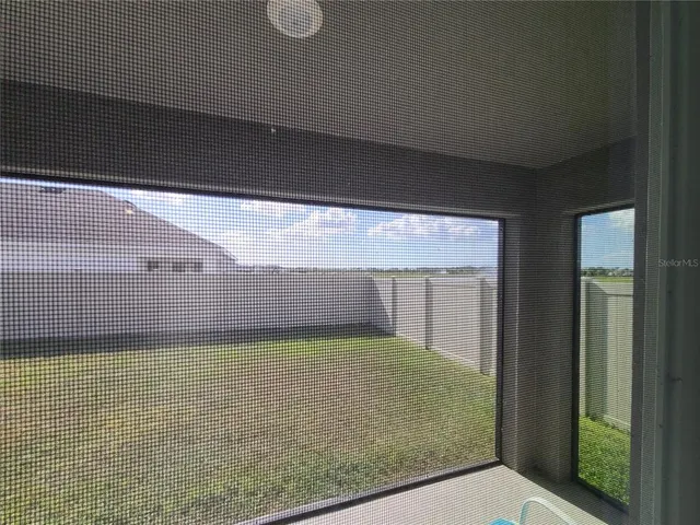 a view of a room with a kitchen