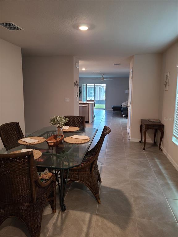 10209 Kalamazoo Place Parrish, FL 34219 - Photo 8 of 25 a view of a dining room with furniture