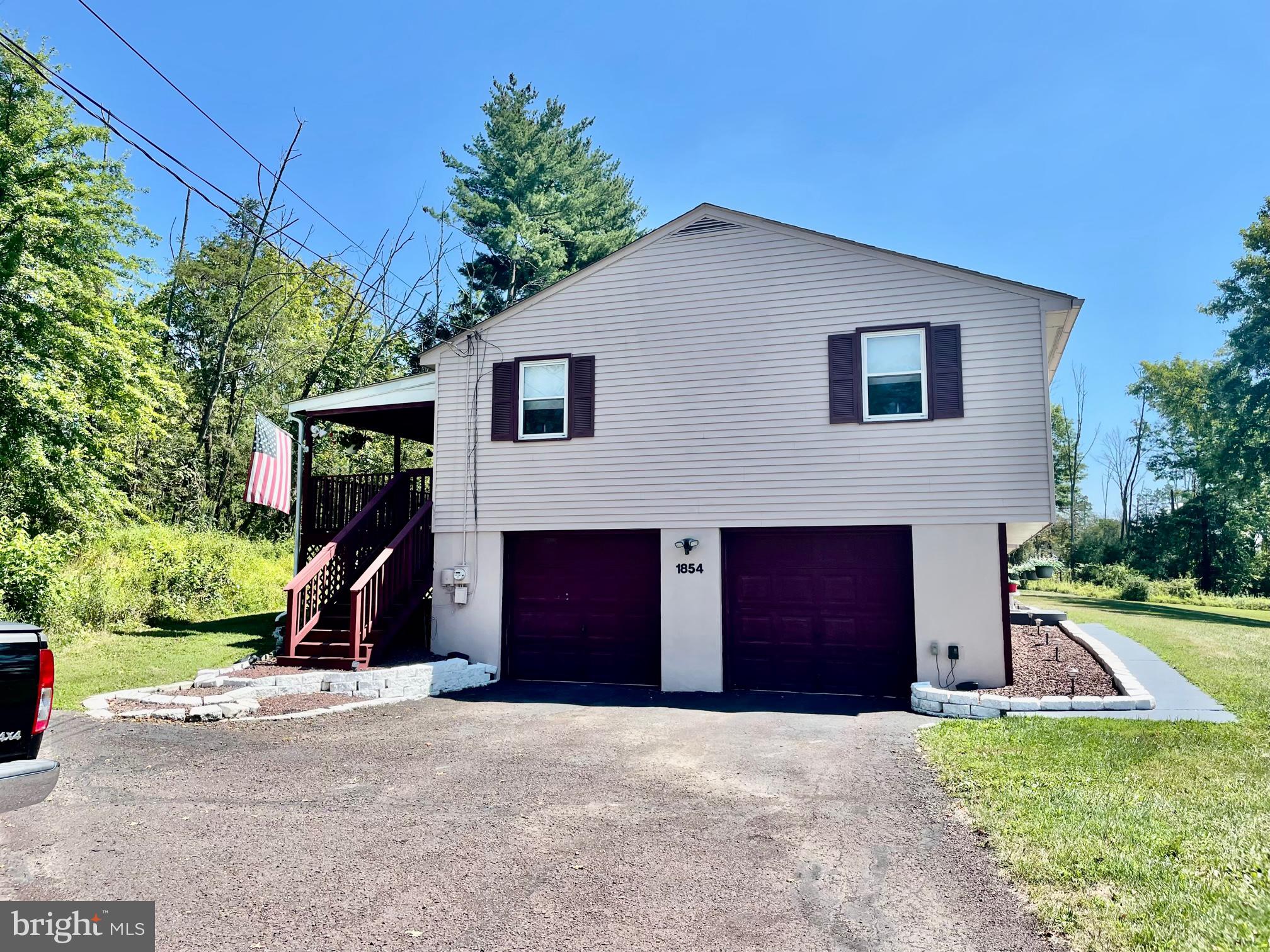 1854 Kumry Road Quakertown, PA 18951 - Photo 2 of 16 Side of house with two-car garage