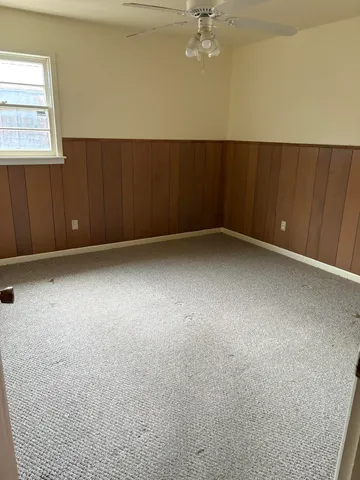 an empty room with a empty space and window
