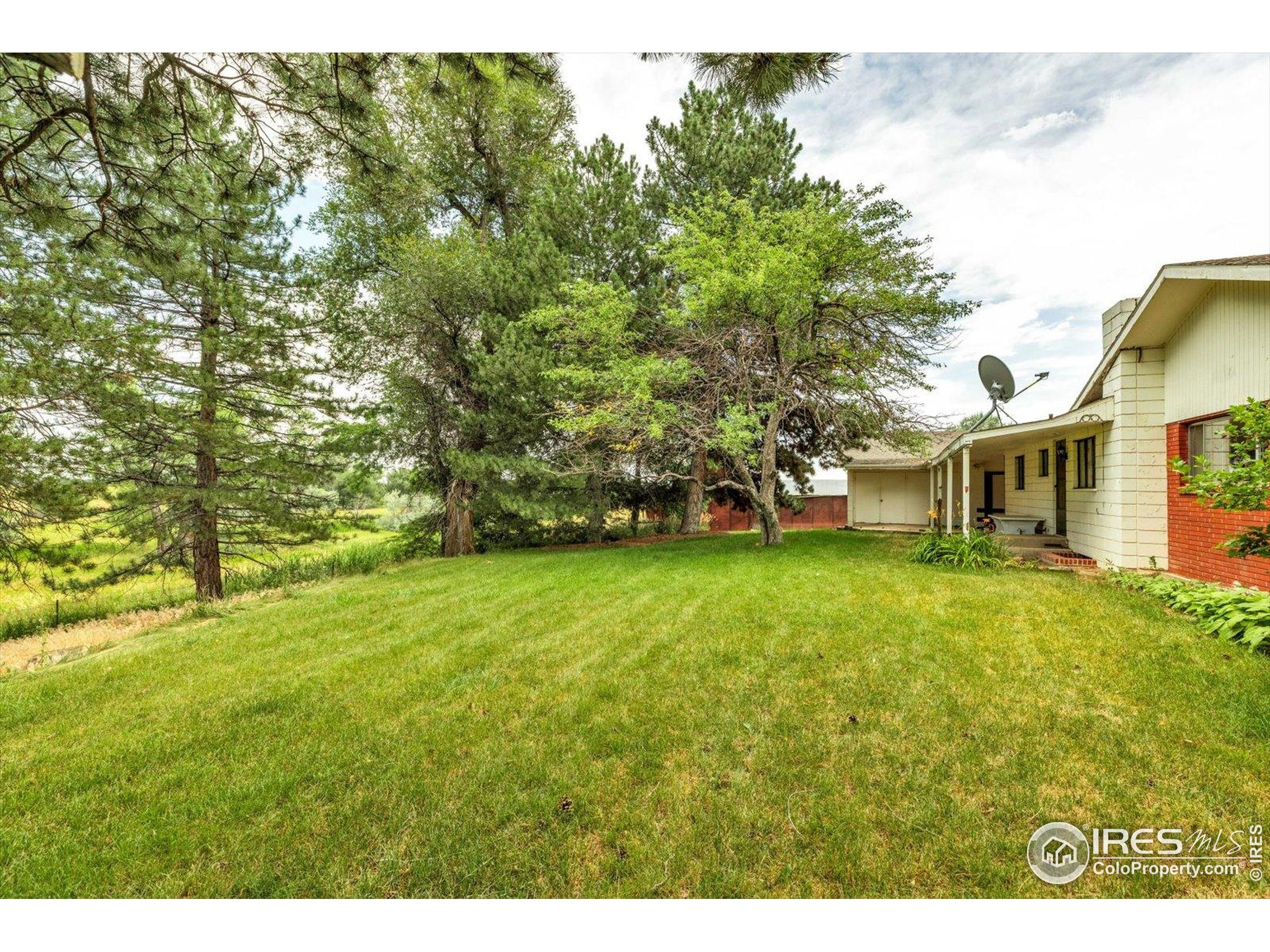 5273 Independence Road Boulder, CO 80301 - Photo 4 of 16 a view of a yard with a house