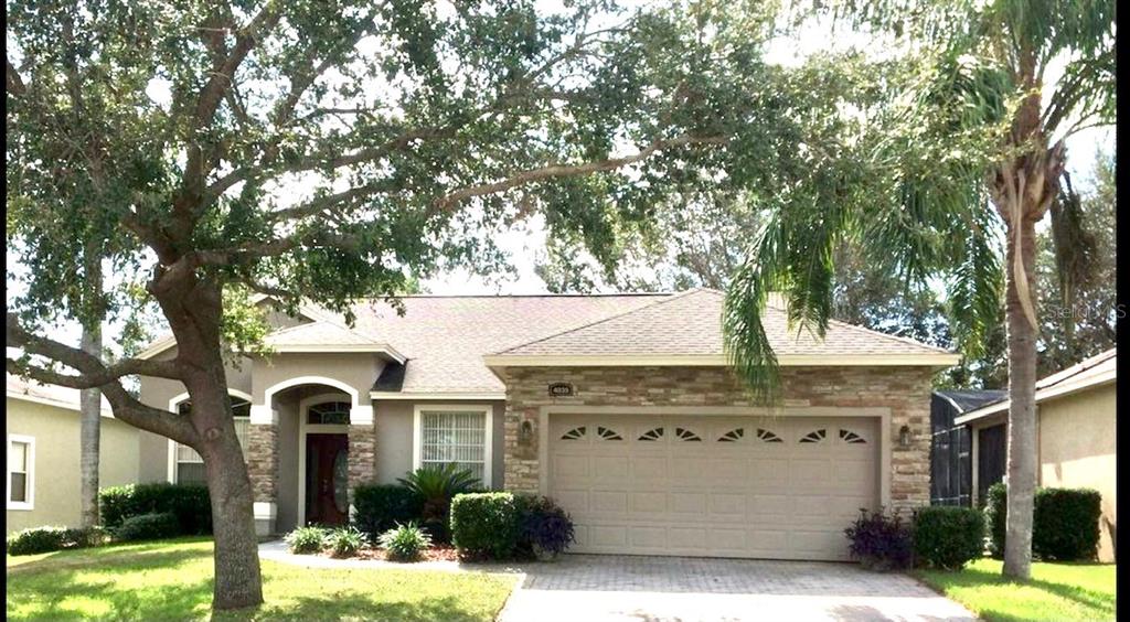 4035 Beacon Ridge Way Clermont, FL 34711 - Photo 1 of 1 a front view of a house with a yard
