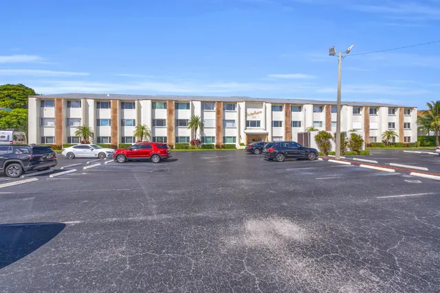 a view of a kitchen with fridge and washer