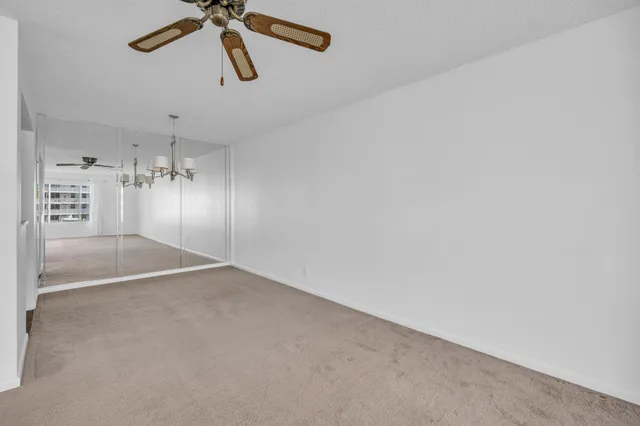 a view of livingroom with hardwood floor and a ceiling fan