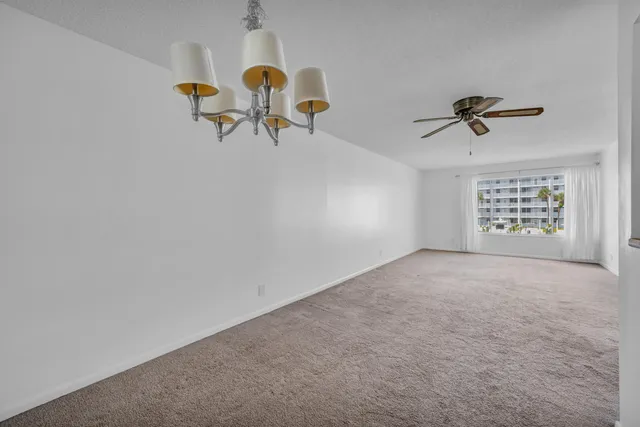 a view of a hallway with a kitchen