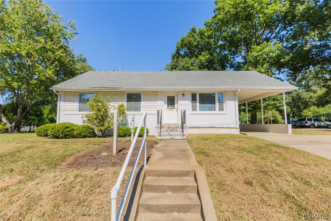 3522 West Hundred Road Chester, VA 23831 - Photo 1 of 29 a front view of a house with a yard and potted plants