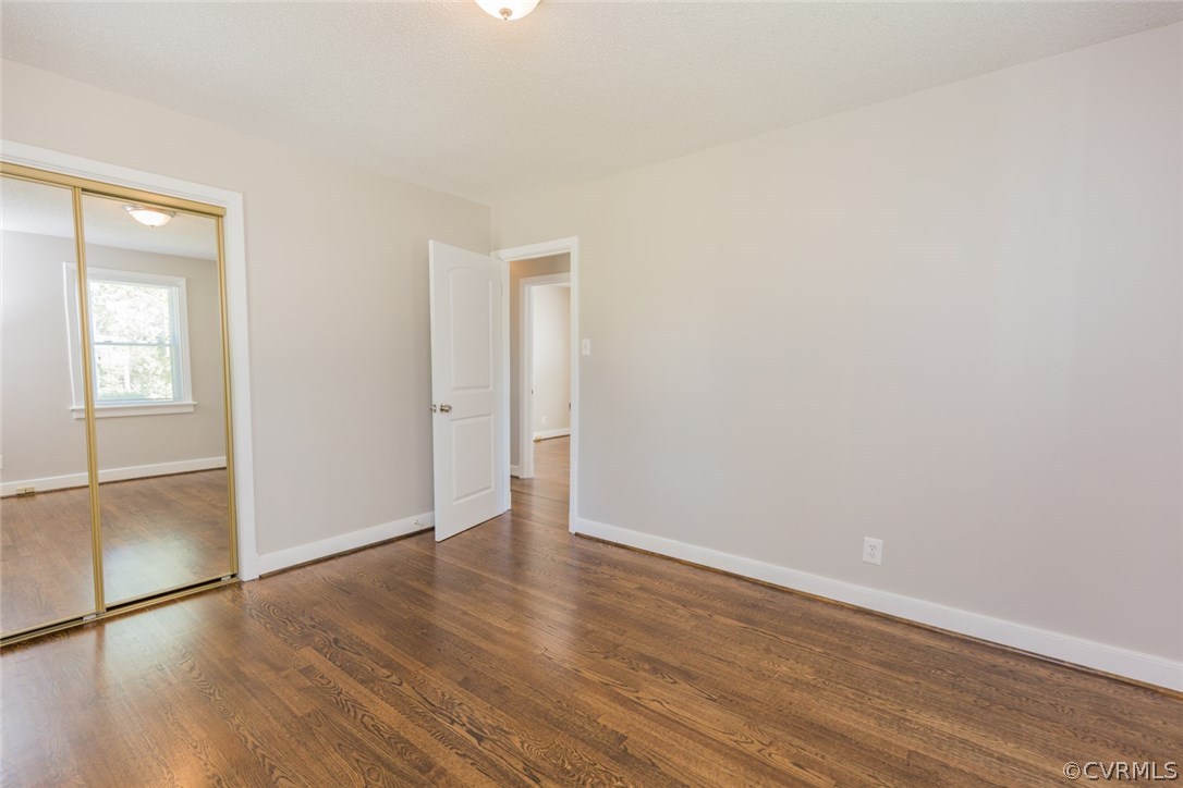 3522 West Hundred Road Chester, VA 23831 - Photo 13 of 29 an empty room with wooden floor and windows