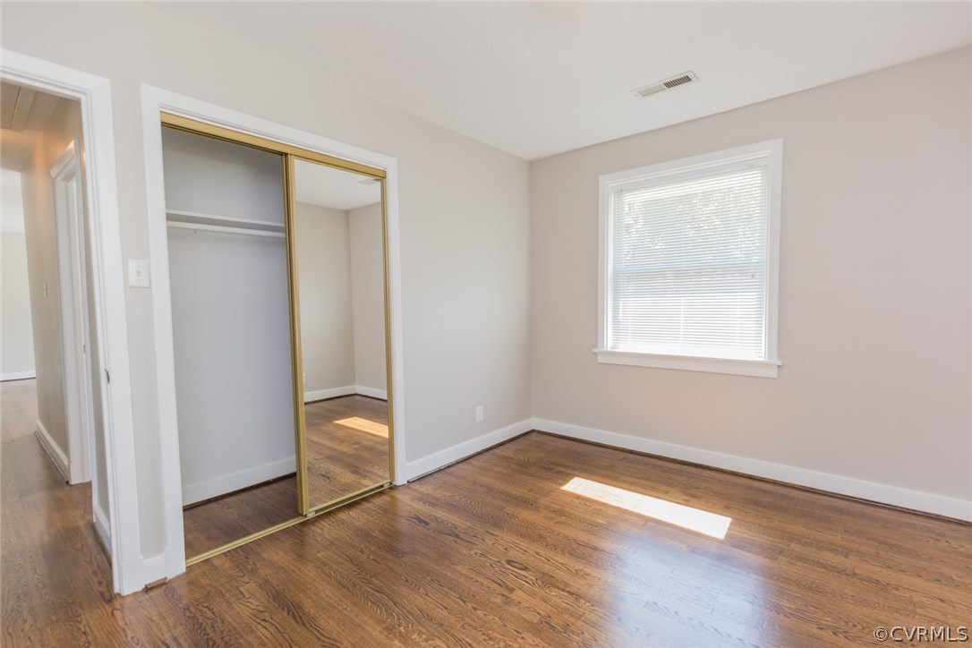 3522 West Hundred Road Chester, VA 23831 - Photo 14 of 29 a view of an empty room with wooden floor and a window