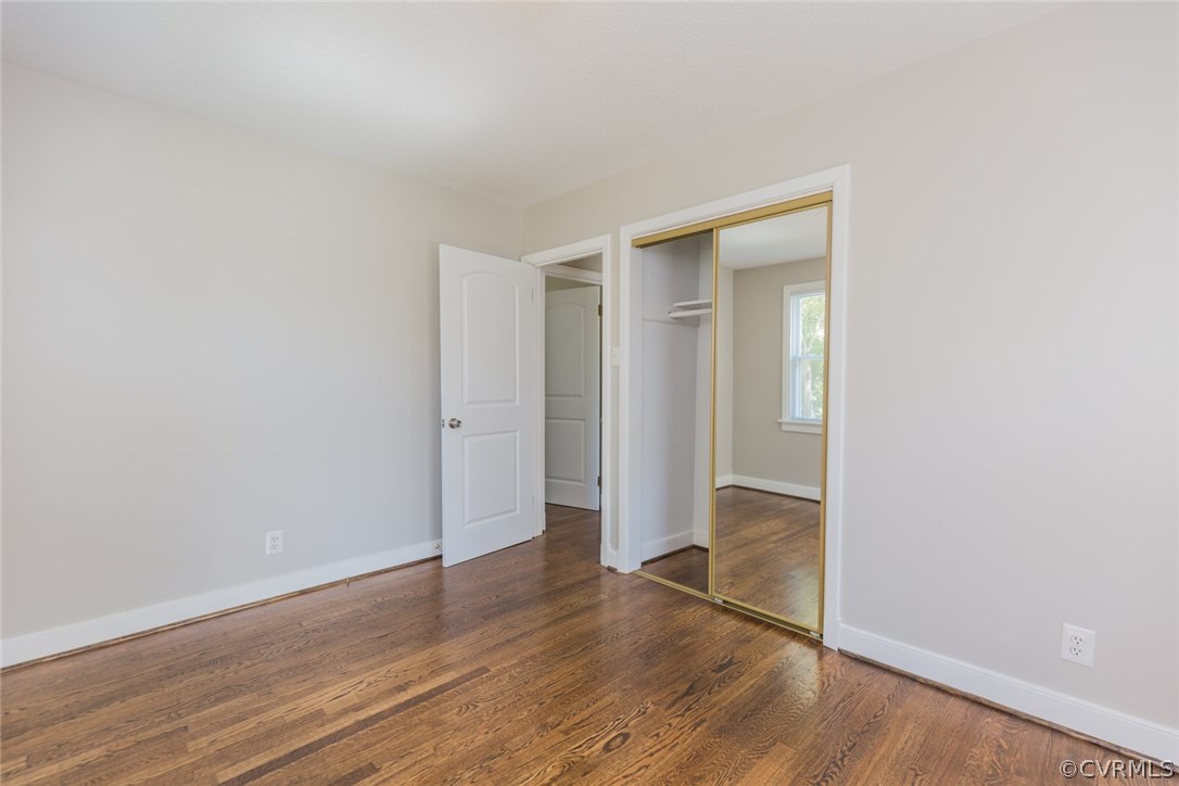 3522 West Hundred Road Chester, VA 23831 - Photo 15 of 29 an empty room with wooden floor & sliding door