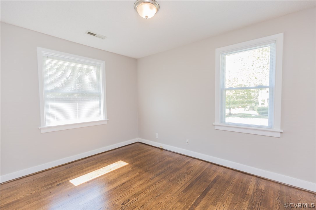 3522 West Hundred Road Chester, VA 23831 - Photo 17 of 29 a view of an empty room with wooden floor and a window