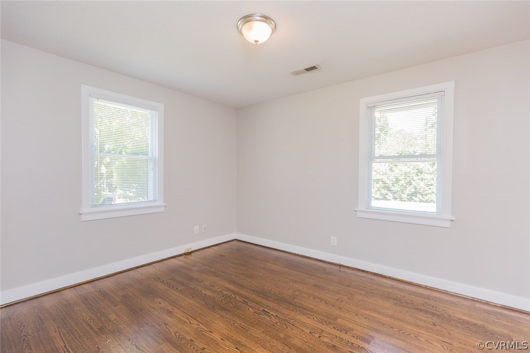 3522 West Hundred Road Chester, VA 23831 - Photo 19 of 29 a view of an empty room with wooden floor and a window