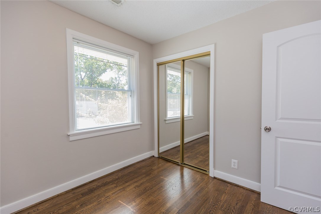 3522 West Hundred Road Chester, VA 23831 - Photo 20 of 29 an empty room with wooden floor closet and windows