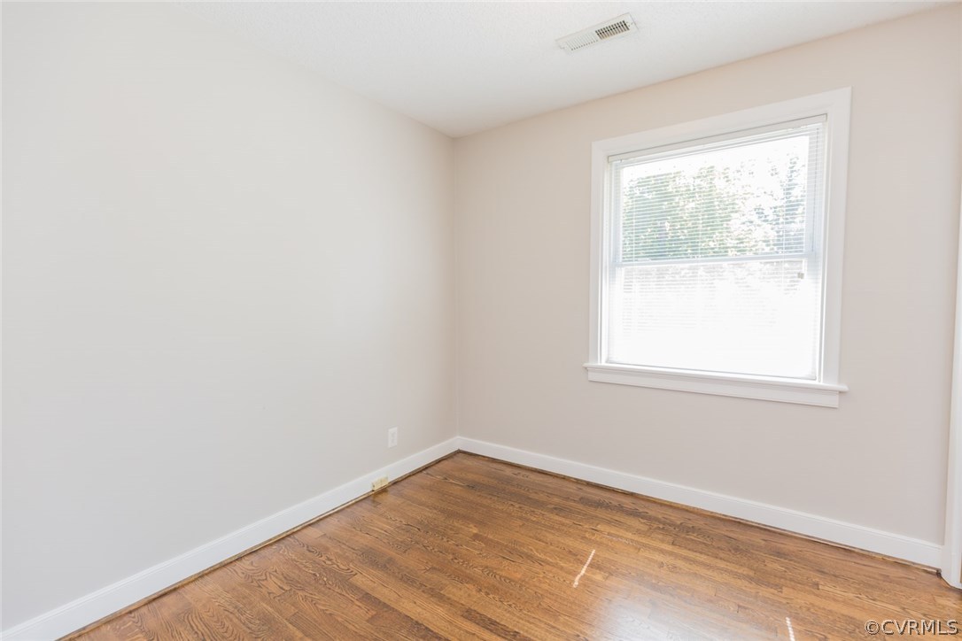 3522 West Hundred Road Chester, VA 23831 - Photo 21 of 29 an empty room with wooden floor and windows