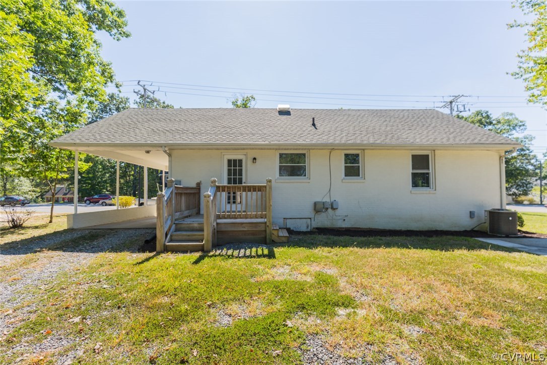 3522 West Hundred Road Chester, VA 23831 - Photo 24 of 29 a view of a patio with table and chairs under an umbrella