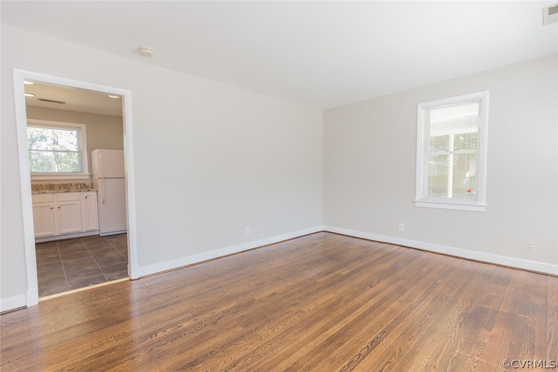 3522 West Hundred Road Chester, VA 23831 - Photo 5 of 29 an empty room with wooden floor and windows