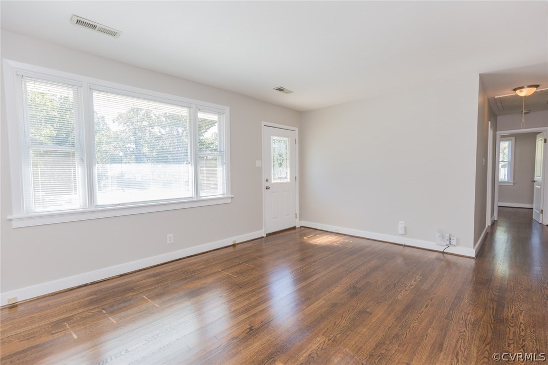 3522 West Hundred Road Chester, VA 23831 - Photo 6 of 29 a view of an empty room with wooden floor and a window