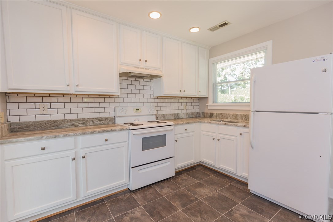 3522 West Hundred Road Chester, VA 23831 - Photo 9 of 29 a kitchen with granite countertop white cabinets and white appliances
