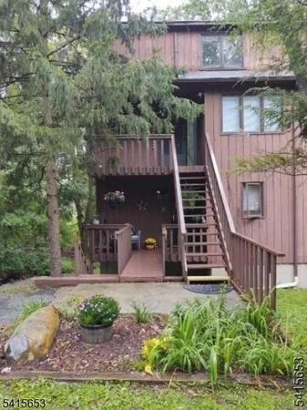 a view of a house with entrance and plants