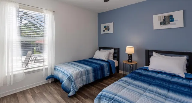 a view of staircase with wooden floor and a window