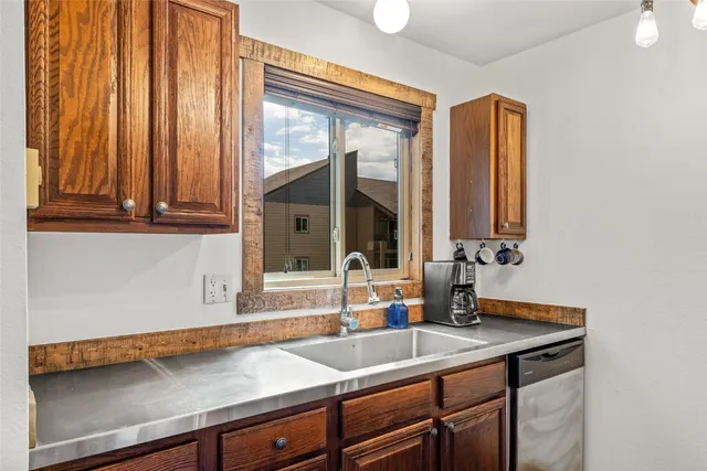 a kitchen with a sink and a window