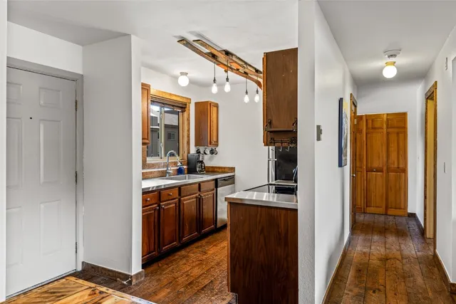 a kitchen with stainless steel appliances granite countertop a stove and a refrigerator
