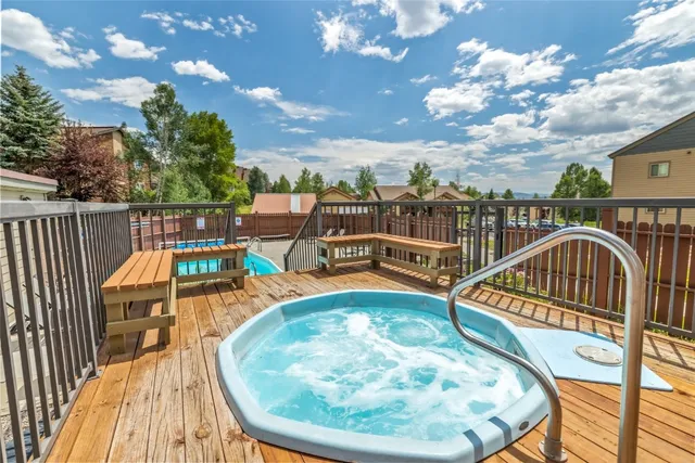 a view of a swimming pool with a deck