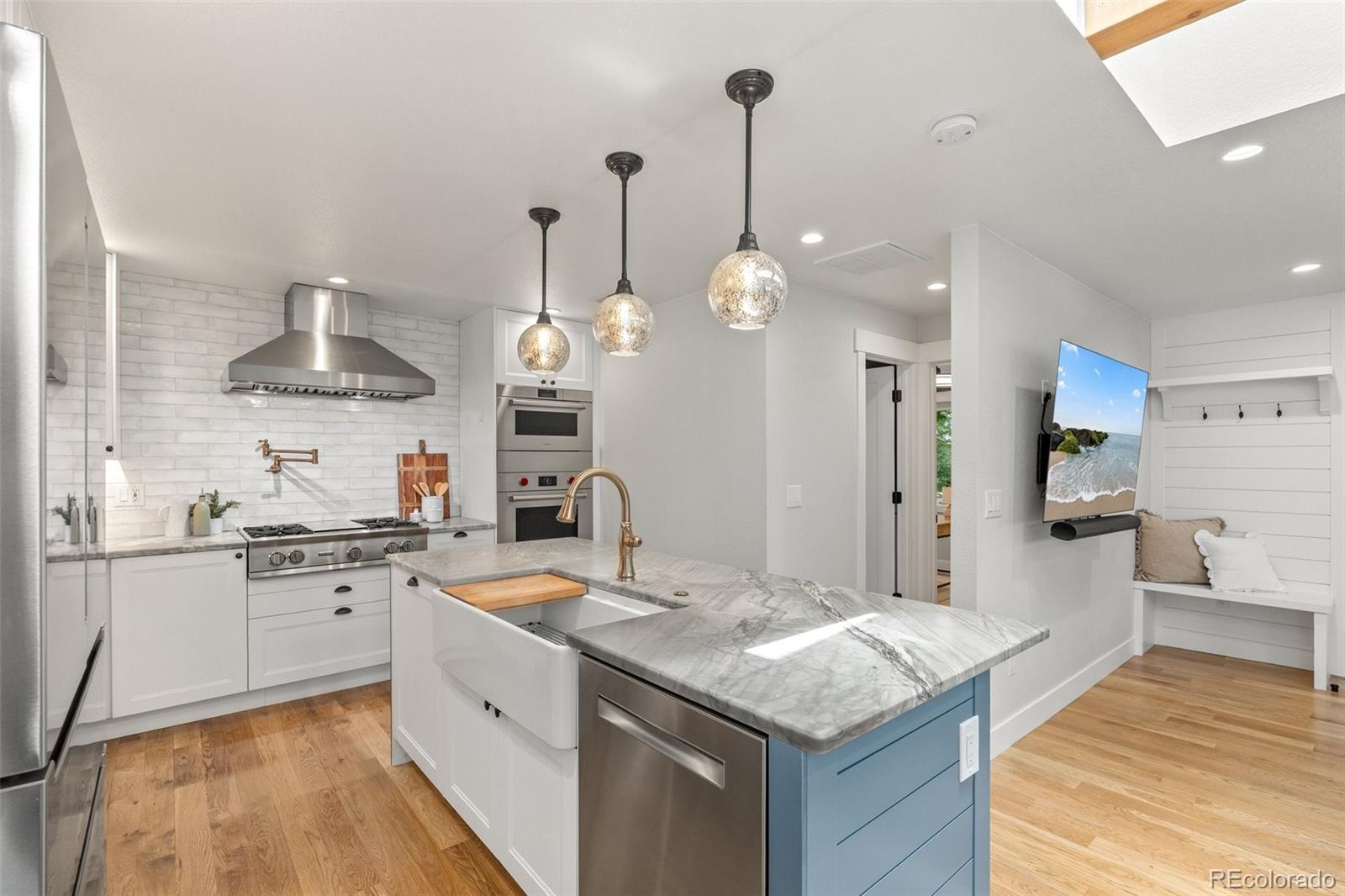 2577 Depew Street Edgewater, CO 80214 - Photo 13 of 47 a kitchen with a sink stove and refrigerator