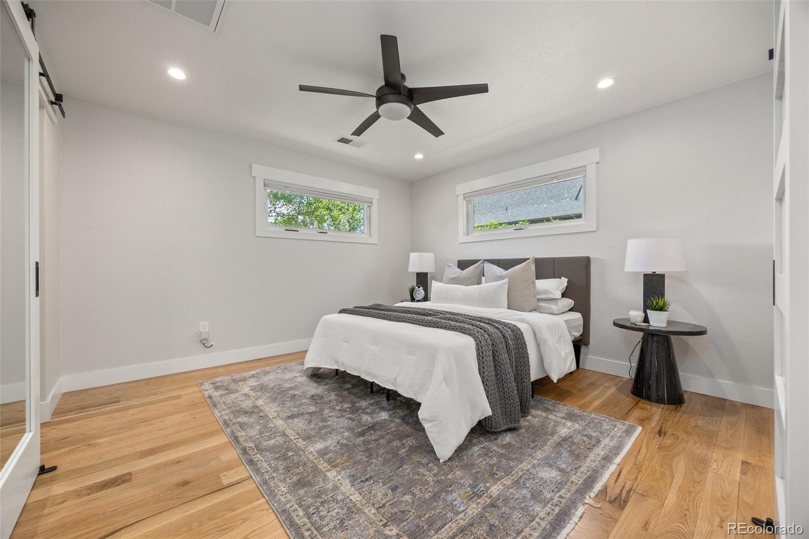 2577 Depew Street Edgewater, CO 80214 - Photo 19 of 47 a bedroom with a bed and wooden floor