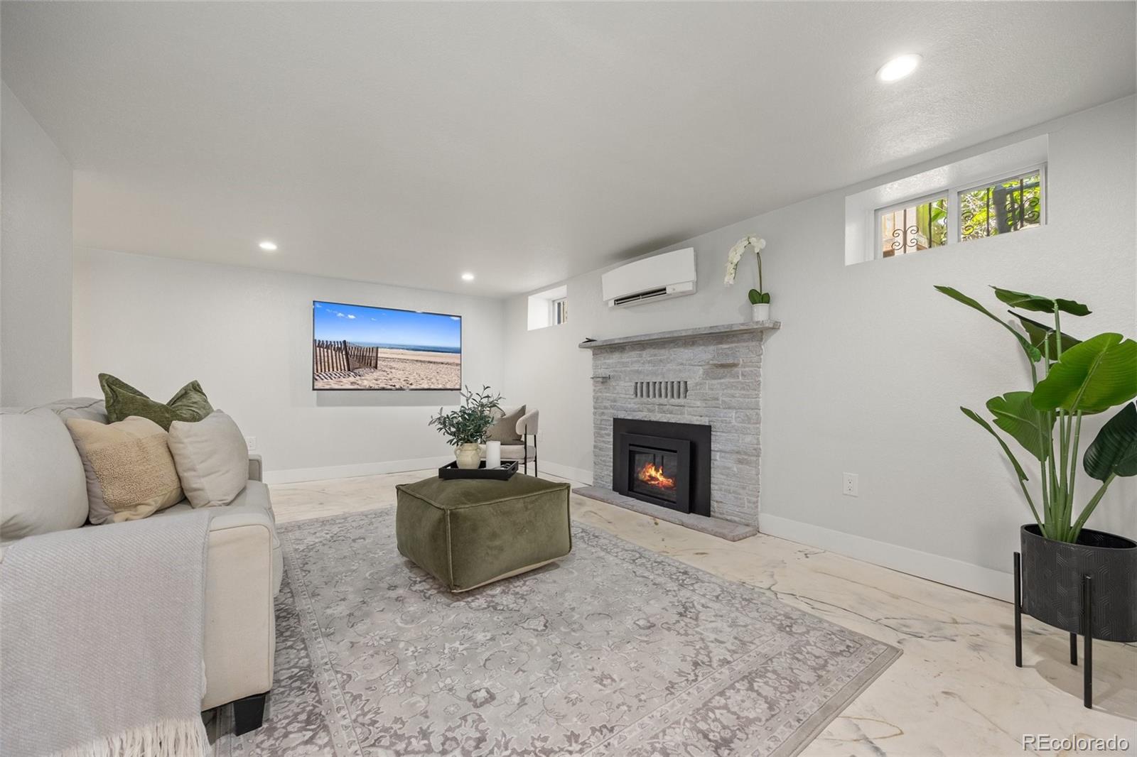 2577 Depew Street Edgewater, CO 80214 - Photo 26 of 47 a living room with furniture and a fireplace