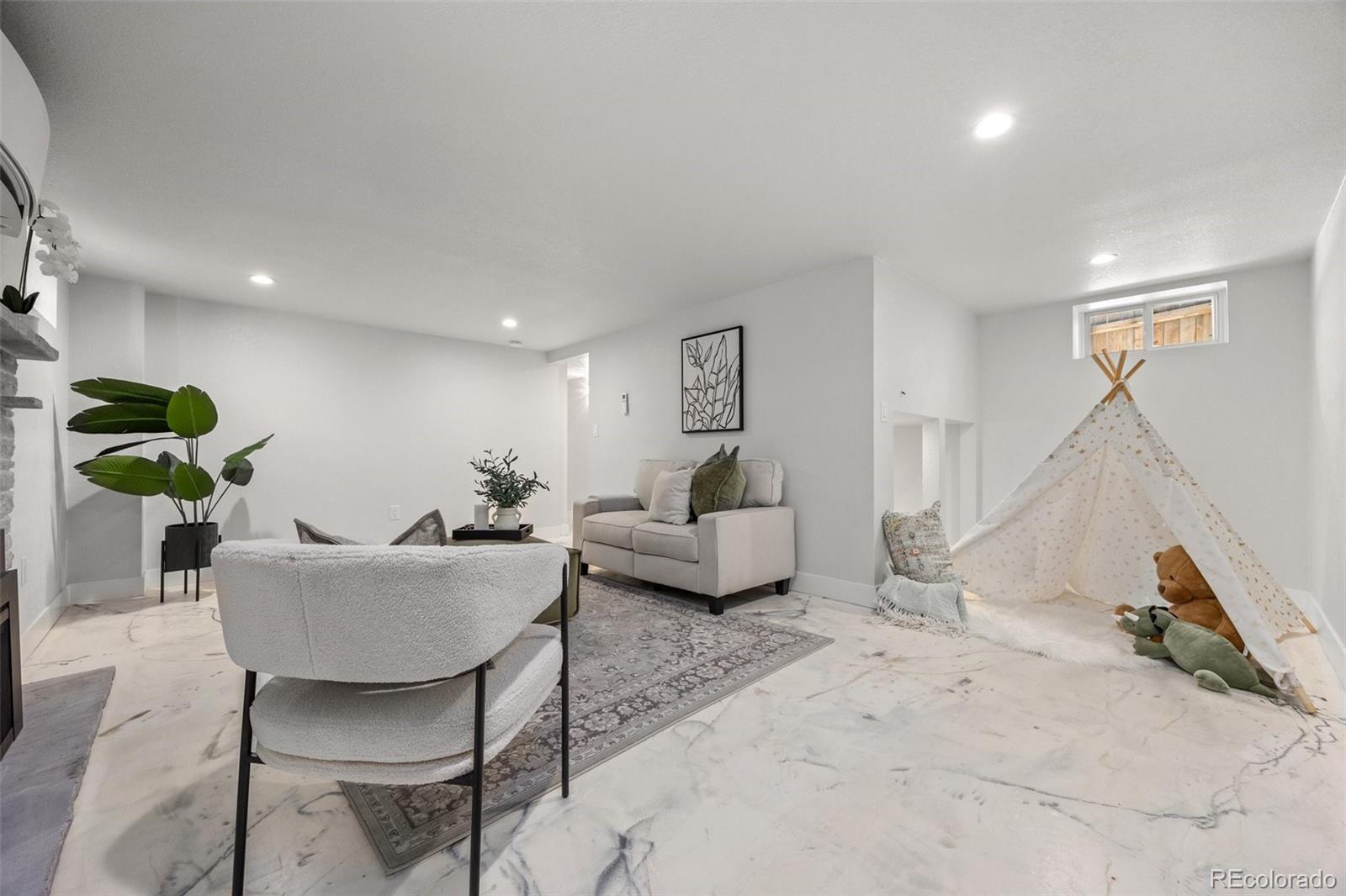 2577 Depew Street Edgewater, CO 80214 - Photo 27 of 47 a living room with furniture and a couch